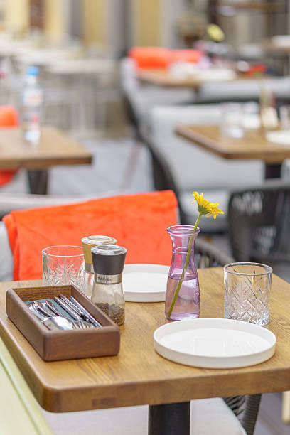 istock Served tables in a summer street restaurant. 2220748756