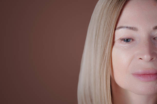 istock Blonde Woman with Light Makeup and Neutral Expression 2220749425