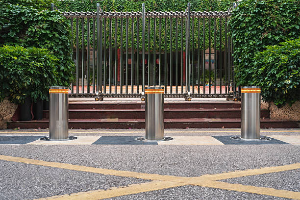 istock Telescopic stainless steel bollards on the square 2220751979