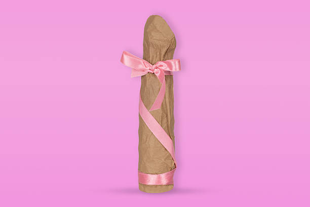 istock Vibrator Wrapped in Craft Paper with Pink Ribbon 2220754914