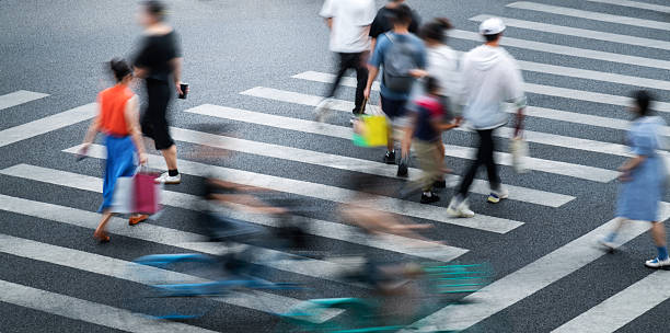 istock Crowd of people walking on crosswalk 2220757569