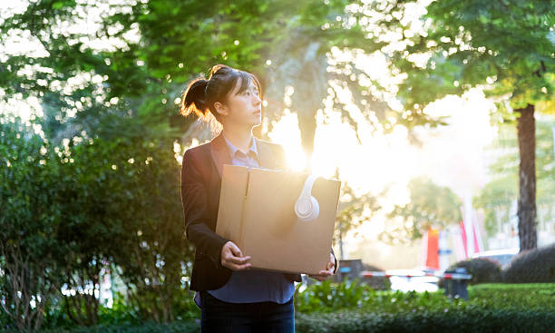 Unemployed woman leaving place of work