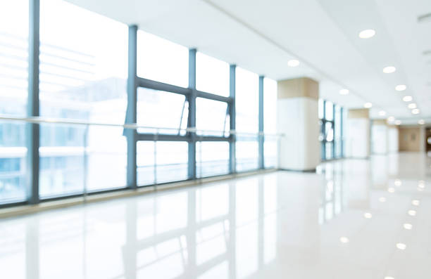istock Blur background of empty corridor in modern hospital building 2220758170
