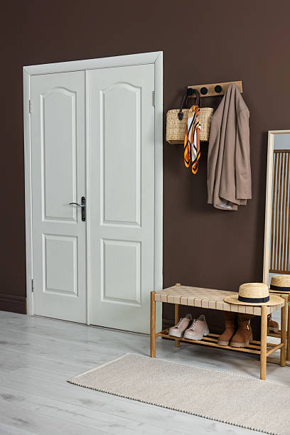 istock Stylish hallway interior with coat rack and bench 2220759580