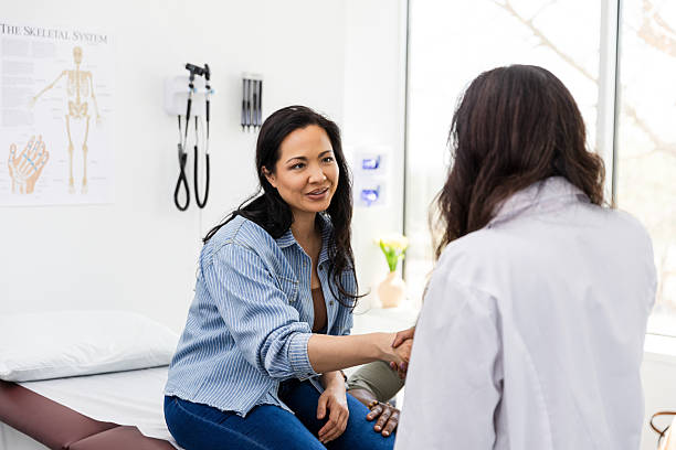 istock Doctor and Patient Handshake in Medical Office 2220760687