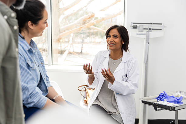 istock Female Doctor Counseling Patients in Office 2220760761