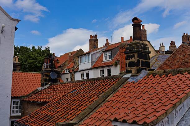 istock The image shows a cluster of buildings with red tiled roofs 2220761237