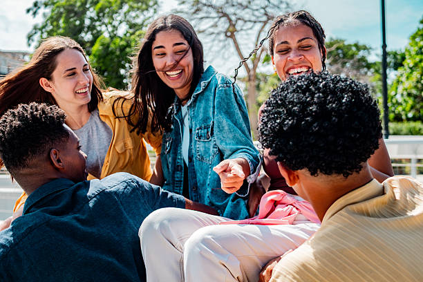 istock Young friends talking outdoors 2220761499