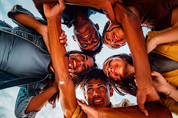 istock Supporting friends togetherness holding hands 2220761789