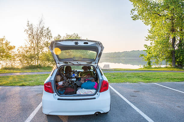 istock Mature man camping in his car trunk 2220762018