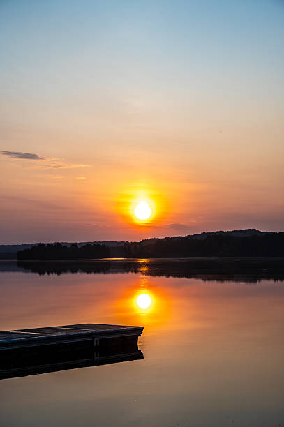 istock Sunrise over a river and pier 2220762753