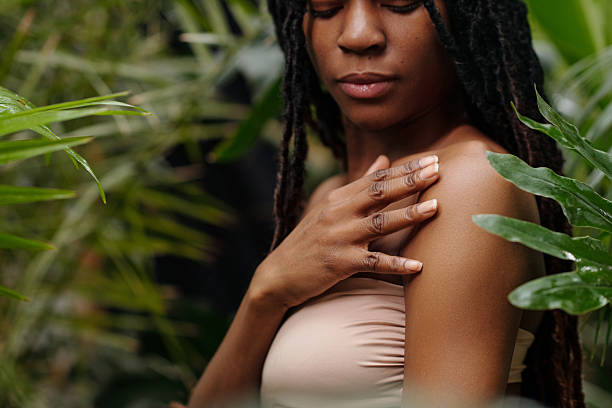 istock Girl Touching Shoulder Among Greenery 2220762819
