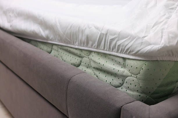 istock Bed with white clean linens at home, closeup 2220762956