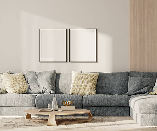 istock Two blank frames in lounge interior with blue sofa and table with wooden panel on the wall, 3d render 2220764323