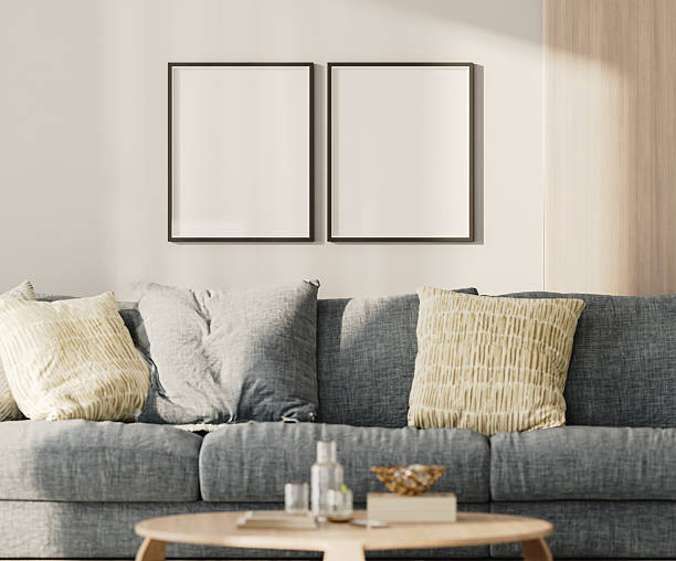 istock Two blank frames in lounge interior with blue sofa and table with wooden panel on the wall, 3d render 2220764379