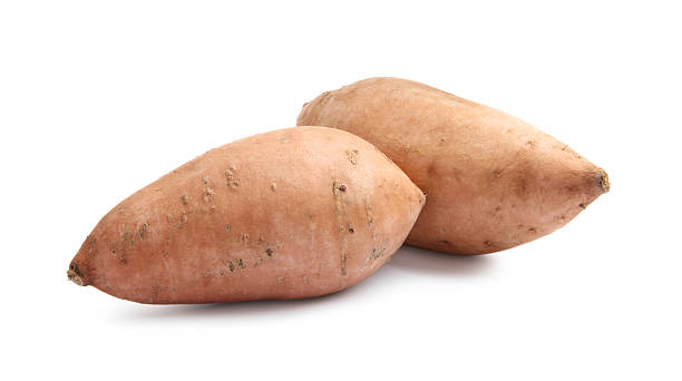 istock Fresh raw sweet potatoes isolated on white 2220765386