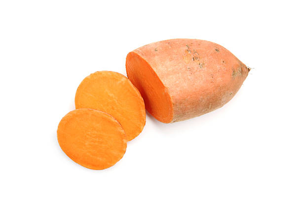 istock Cut raw sweet potato isolated on white, top view 2220765479
