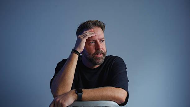 Studio video portrait of man feeling sad and stressed