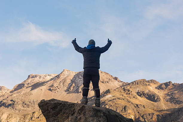 istock Hiker celebrating reaching iztaccihuatl volcano summit 2220770713