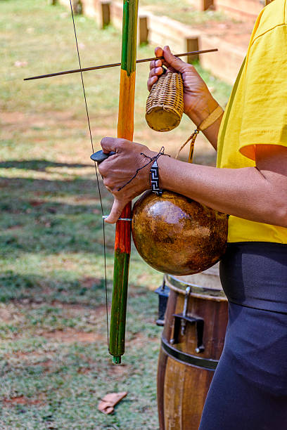 istock Woman playing berimbau 2220781040