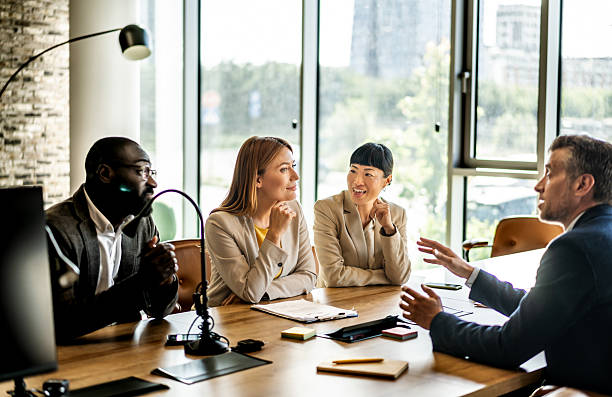 istock Diverse business team engaging in collaborative discussion in modern office 2220786381