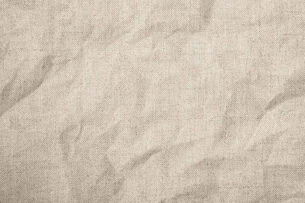 istock Texture of crumpled natural light beige linen fabric. 2220787869