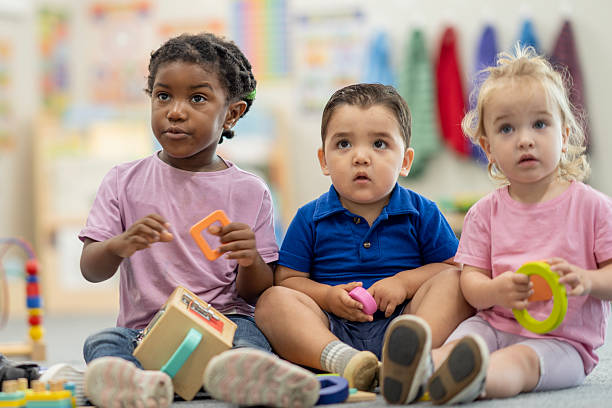 istock Three Children Playing and Learning Together in a Cozy Preschool Environment 2220789190