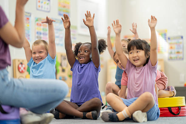 istock Happy Children Actively Participating in a Fun Preschool Classroom Activity Together 2220789482