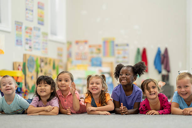 istock Group of Happy Children Smiling in a Bright Classroom Setting 2220789890