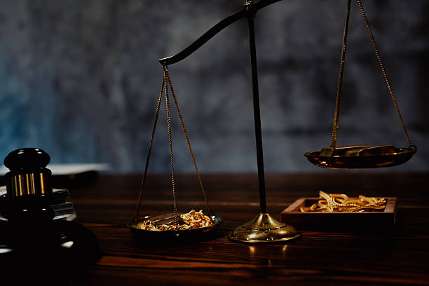 istock Balancing Gold and Legal Power 2220789952