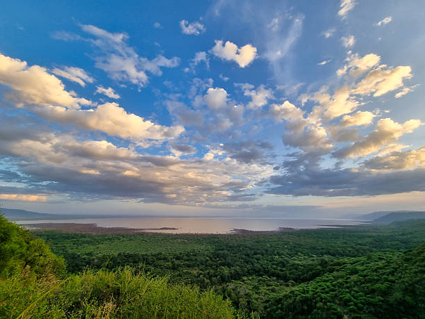 istock Enjoy stunning mountain views under a cloudy sky, surrounded by lush greenery and adventure 2220790379