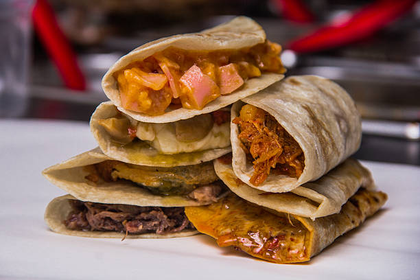 istock A vibrant display of different tacos filled with various ingredients showcasing the diversity and richness of flavors typical in Mexican cuisine presented appealingly. 2220791615