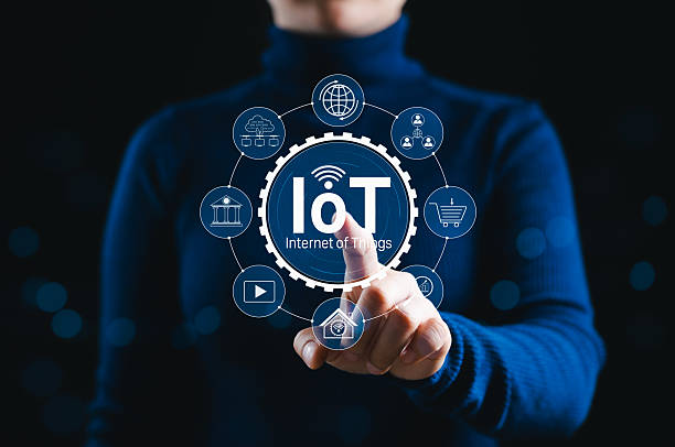 istock Internet of Things (IoT) Technology Concept. A person touches glowing IoT interface with icons representing smart devices, connectivity, and various Internet of Things applications across industries. 2220794664