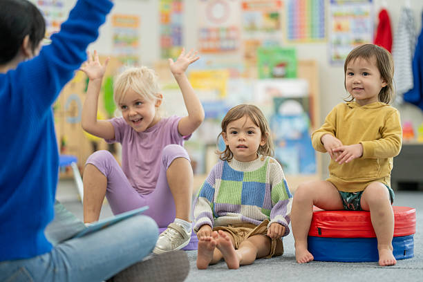 istock Group of Children Participating in an Interactive Classroom Activity 2220797079