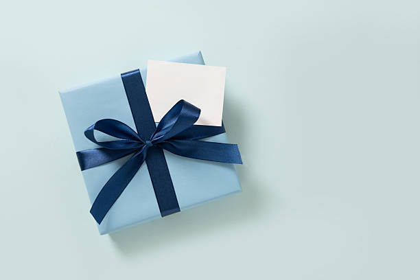 istock Happy Fathers Day gift box and label on blue background. View from above. 2220797519