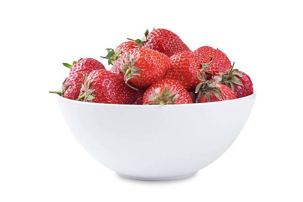 istock Fresh red strawberries in a white bowl on a white isolated background 2220798829