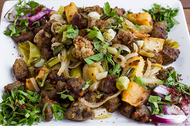 Above view of Albanian pan-fried liver with potato and herbs, arnavut cigeri