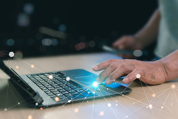 istock Close-up, Digital technology information network concept. Using a laptop to connect to the internet. A man using laptop play social media to search for information. Black background with bokeh. 2220807075