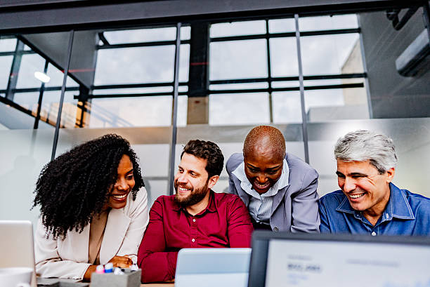 istock Smiling coworkers talking at the office 2220807751