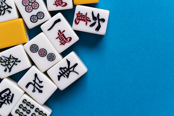 istock Mahjong tiles lined up on a blue background 2220809306