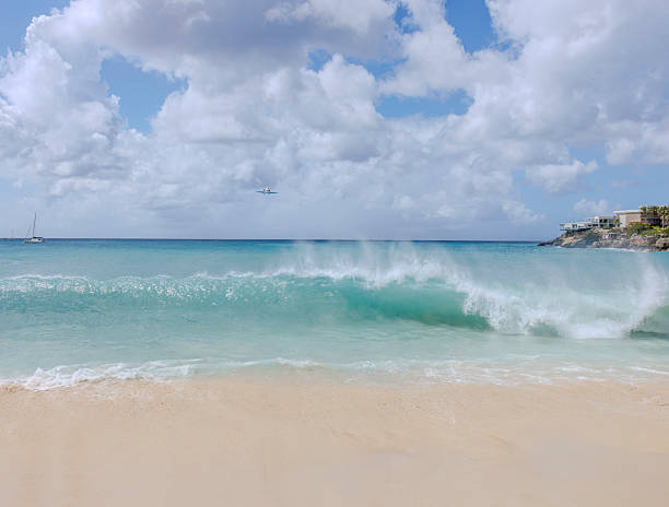 Planes flying over the beach at St. Maarten is one of the most thrilling, surreal, and iconic travel experiences in the world.