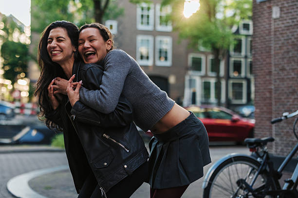 istock Two young women laughing and having fun in Amsterdam 2220812616