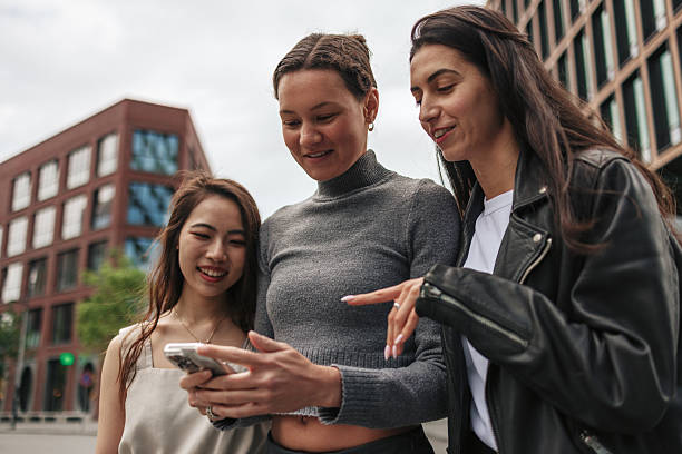 istock Young women using a smartphone in the city center 2220812694