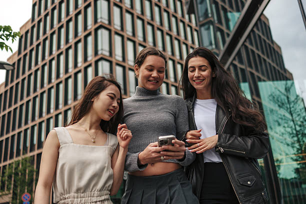 istock Young women using smartphone in urban environment 2220812702