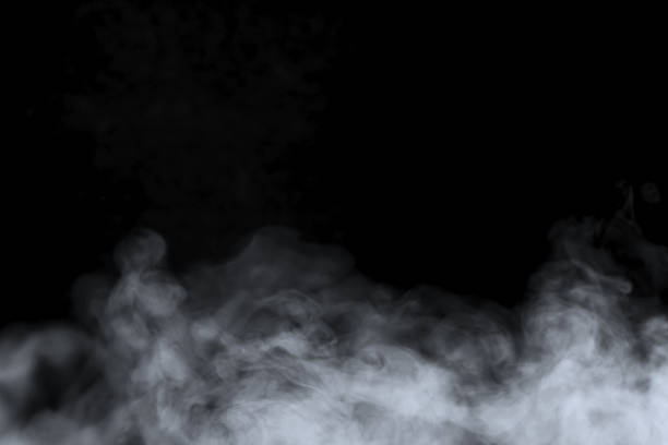 Abstract art. Grey smoke on a black background.