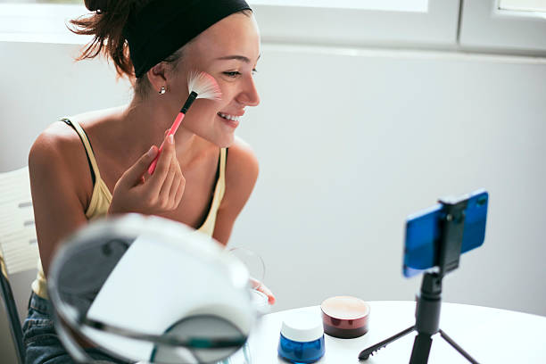 istock A happy beauty content creator gives a make-up tutorial to her followers 2220814206