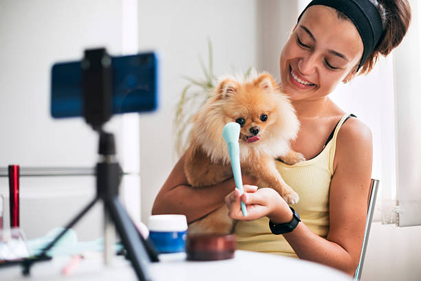 istock Happy influencer mixing beauty content and pet love on camera 2220814268