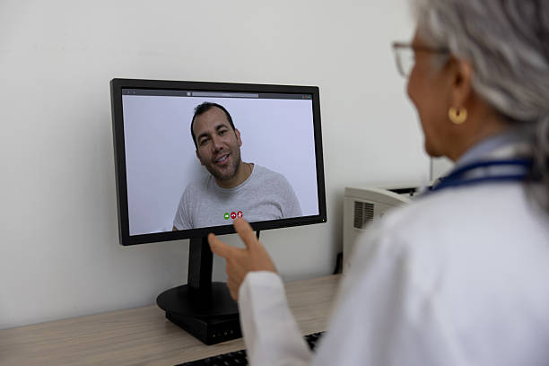 istock Doctor at her office talking to a patient on a video call 2220814647