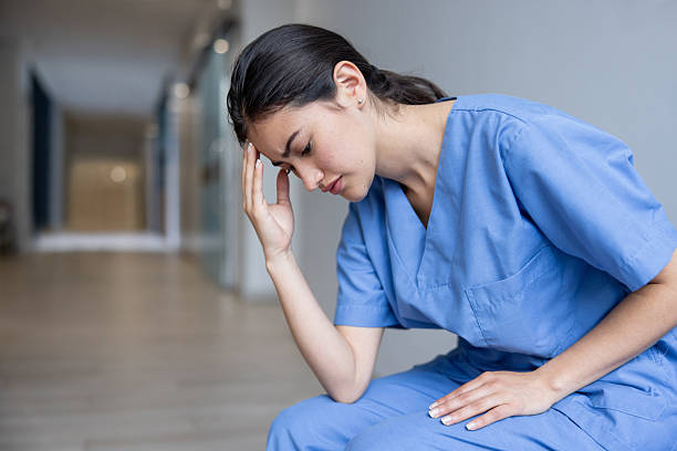 istock Nurse having a headache while working at the hospital 2220816293