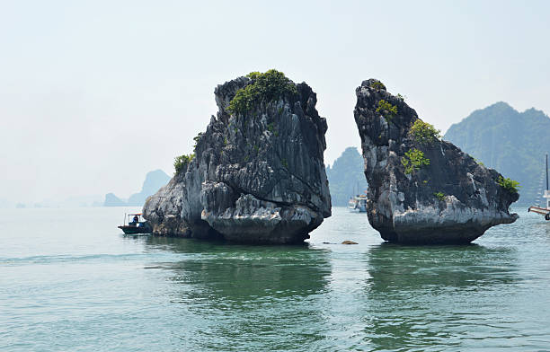 Ha Long, Vietnam - August 8, 2019 : Rooster and Hen Rocks on Halong Bay